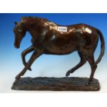 A BRONZE MODEL OF A HORSE ON