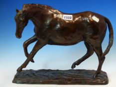 A BRONZE MODEL OF A HORSE ON