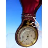 A LEATHER CASED NEGRETTI AND ZAMBRA POCKET BAROMETER WITH ADJUSTMENTS FOR HEIGHT ABOVE SEA LEVEL,