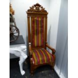 A PAIR OF CARVED OAK VICTORIAN IMPRESSIVE ARMCHAIRS, THE RECTANGULAR BACKS UPHOLSTERED IN STRIPED VE