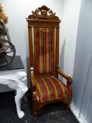 A PAIR OF CARVED OAK VICTORIAN IMPRESSIVE ARMCHAIRS, THE RECTANGULAR BACKS UPHOLSTERED IN STRIPED VE