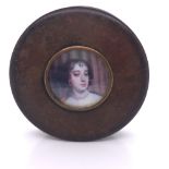 A BOIS DURCI SNUFF BOX INSET WITH A PRINTED PORTRAIT MINIATURE OF AN 18th C. LADY. Dia. 6cms.