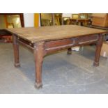 A 19th.C. GOTHIC REVIVAL OAK REFECTORY TABLE WITH PLANK TOP OVER PANELED FRIEZE AND SHAPED SQUARE