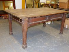 A 19th.C. GOTHIC REVIVAL OAK REFECTORY TABLE WITH PLANK TOP OVER PANELED FRIEZE AND SHAPED SQUARE