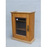 A SMALL GLAZED OAK WALL CABINET. 42 x 54 x 20cms.