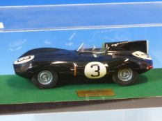 A SCALE MODEL D-TYPE JAGUAR FIRST IN THE 1955 LE MANS, THE CAR WITH RACE NUMBER 3 AND WITHIN PERSPEX