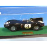 A SCALE MODEL D-TYPE JAGUAR FIRST IN THE 1955 LE MANS, THE CAR WITH RACE NUMBER 3 AND WITHIN PERSPEX