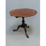AN ANTIQUE MAHOGANY BIRD CAGE TRIPOD TABLE, THE DISHED CIRULAR TOP ON BALUSTER COLUMN, THE THREE