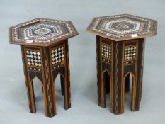 AN ISLAMIC HEXAGONAL TABLE, THE BANDS OF GEOMETRIC INLAY TO THE TOP ENCLOSING A ROUNDEL OF EBONY