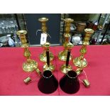 TWO PAIRS OF BRASS CANDLESTICKS. H 30.5 AND 26.5cms. TOGETHER WITH A MODERN PAIR OF BRASS TOPPED