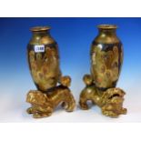 A PAIR OF SATSUMA POTTERY OVOID VASES PAINTED WITH KWANNON AND LUOHANS ON A BLACK GROUND, THE
