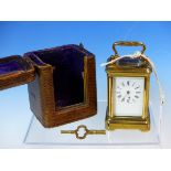 A LEATHER CASED MINIATURE CARRIAGE TIMEPIECE, THE CASE. H 8cms.