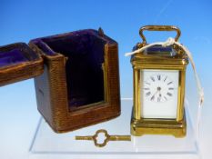 A LEATHER CASED MINIATURE CARRIAGE TIMEPIECE, THE CASE. H 8cms.