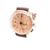 AN 18ct GOLD SWISS GENTLEMANS CHRONOMETER WRIST WATCH, WITH TAN LEATHER STRAP. CASE DIAMETER 35mm.