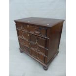 AN ANTIQUE CAROLEAN STYLE OAK CHEST OF FOUR LONG DRAWERS WITH GEOMETRIC PANEL DECORATION. 92 x 57