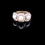 A DIAMOND AND PEARL TRIPLE CLUSTER RING. THE THREE CULTURED PEALS SURROUNDED BY A HALO OF OLD CUT