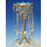 A BOHEMIAN WHITE OVERLAID SKY BLUE GLASS LUSTRE, THE WHITE GILT WITH FOLIAGE SCROLLS. H 25cms.