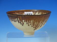 A DAVID FRITH BOWL, THE RIM OF THE CREAM GLAZED BODY BROWN WITH PENDANT DRIPS IN THE LUCIE RIE