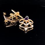 AN EDWARDIAN AMETHYST, DIAMOND AND GOLD OPEN WORK PENDANT TOGETHER WITH A 9ct GOLD ANCHOR BROOCH