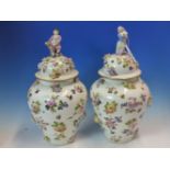 A PAIR OF FLORAL ENCRUSTED AND PAINTED HARD PASTE PORCELAIN VASES AND COVERS, ONE COVER SURMOUNTED