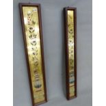 TWO SIMILAR VICTORIAN FRAMED GLASS PANELS, EACH WITH AESTHETIC POLYCHROME FLORAL DECORATION ON A