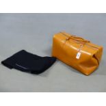 A TANNER KROLLE TAN LEATHER TRAVEL BAG OF GLADSTONE TYPE WITH ZIP CLOSURE AND TWO STRAP HANDLES, THE