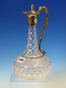 A CUT GLASS GLOBE AND SHAFT CLARET JUG WITH ELECTROPLATE MOUNTS CAST WITH VINES