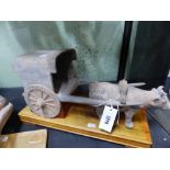 AN EARLY CHINESE GREY POTTERY FIGURAL GROUP OF A COW AND CART. POSSIBLY HAN DYNASTY. H. 20cm.