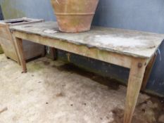 A LIMESTONE TOPPED MAHOGANY TABLE ON TAPERING SQUARE SECTIONED LEGS. W 184 x D 77 x H 73cms.