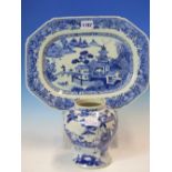 AN 18th C. CHINESE BLUE AND WHITE CANTED RECTANGULAR PLATTER PAINTED WITH AN ISLAND SCENE. W