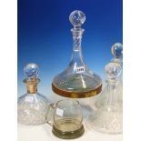 FIVE VARIOUS SHIPS DECANTERS TO INCLUDE ONE WITH SILVER MOUNTS, A WOODEN PRESENTATION COASTER, A