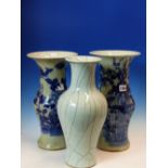 TWO SIMILAR CHINESE CELADON GROUND VASES PAINTED IN BLUE WITH FLOWERS AND FOLIAGE. H 37cms. TOGETHER