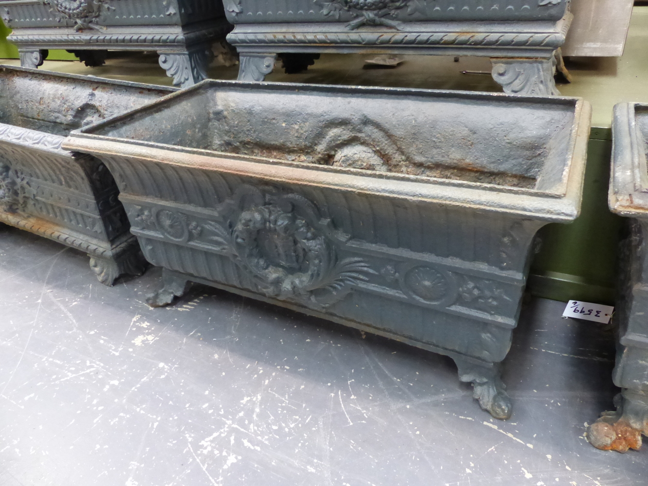 A HARLEQUIN SET OF SIX ANTIQUE IRON PLANTERS, THE RECTANGULAR RIMS OVER FLUTED BANDS AND CENTRAL - Image 3 of 11