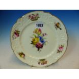 A NANTGARW PLATE PAINTED WITH CENTRAL BUNCH OF FLOWERS WITHIN A MOULDED RIM PAINTED WITH FLOWERS,