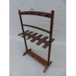 A 19th.C. MAHOGANY WHIP RACK WITH BRASS HANDLE AND SLED FEET. 62cm (W) x 96cm (H).