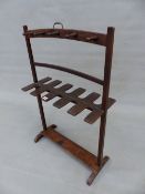 A 19th.C. MAHOGANY WHIP RACK WITH BRASS HANDLE AND SLED FEET. 62cm (W) x 96cm (H).