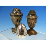 A SILVER HALLMARKED EGG FORM PEPPER AND TWO FURTHER HALLMARKED SILVER PEPPERS. GROSS WEIGHT 169.