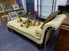 A REGENCY STYLE YELLOW UPHOLSTERED EBONISED CHAISE LONGUE, GILT BRASS ROSETTES APPLIED ABOVE THE