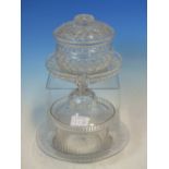 TWO CUT GLASS SWEETMEAT JARS, COVERS AND STANDS, ONE WITH STRAWBERRY CUT DIAMOND DIAPER BANDS, THE