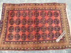 AN ANTIQUE PERSIAN KESHAN RUG, 196 x 134cms. TOGETHER WITH AN AFGHAN BOKHARA RUG.