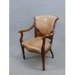 AN EDWARDIAN MAHOGANY ELBOW CHAIR THE LEATHER UPHOLSTERED BACK ABOVE FLORAL MARQUETRY, THE SERPENTIN