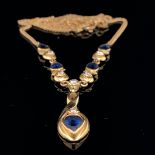 AN 18ct YELLOW GOLD SAPPHIRE AND DIAMOND SET NECKLET. LENGTH 41cms, EXCLUDING DROPPER. GROSS