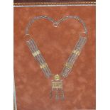 THREE FRAMES OF EASTERN TRIBAL JEWELLRY COMPRISING TWO WHITE METAL NECKLACES ONE HAVING CORAL, TU
