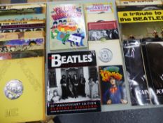 TEN BEATLES ALBUMS, TWO JOHN LENNON CALENDARS , PENGUIN "JOHN LEMON" BOOK, YELLOW SUBMARINE GIFT