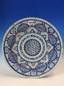 A MID 18th C. ENGLISH DELFT BLUE AND WHITE DISH PAINTED WITH A CENTRAL ROUNDEL OF DIAMOND DIAPER