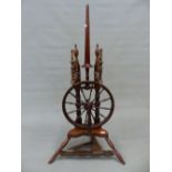 A 19th.C. FRUITWOOD SPINNING WHEEL. 107cm (H).