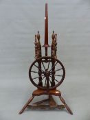 A 19th.C. FRUITWOOD SPINNING WHEEL. 107cm (H).