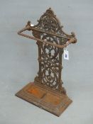 A 19th C. CAST IRON STICK STAND, THE TREFOIL CRESTING OVER A FIGURE OF EIGHT FOLIATE BACK AN