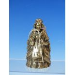 A WHITE METAL HAND BELL CAST AS AN ELDERLY LADY CARRYING HER DOG AND WEARING A CRINOLINE. H 11cms.