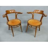 A PAIR OF THONET ELBOW CHAIRS, THE ROUND SEATS UPHOLSTERED IN DEEP TERRACOTTA CORDUROY